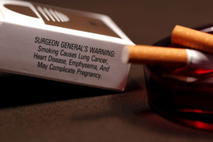 Cigarette pack with warning