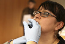Woman receives seasonal flu shot