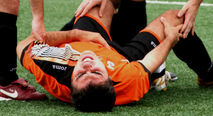 A player falling on ground due to cardiac arrest