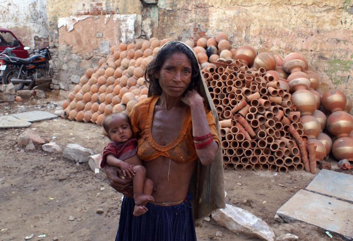 A poor mother and child in India