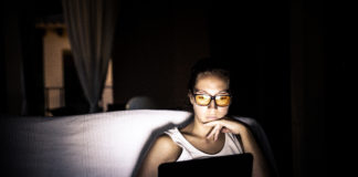 Girl with laptop at night