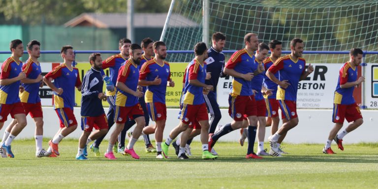 Footballers doing warm up exercise