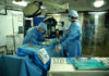 Doctors perform surgery in operation theatre