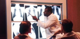 Radiologist examines chest x-rays