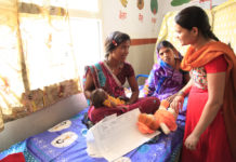 India, a health worker explains the importance of breastfeeding