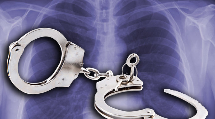 Handcuffs against a background of chest X ray