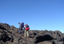 A couple climbing mountains