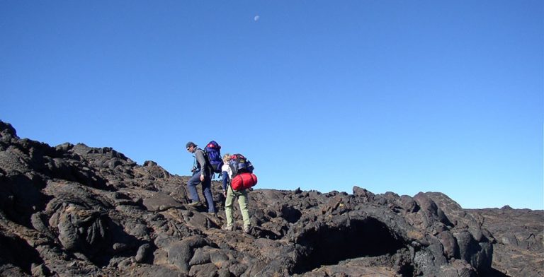 A couple climbing mountains