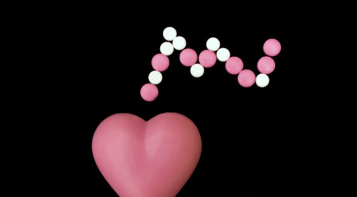 Heart symbol with pills