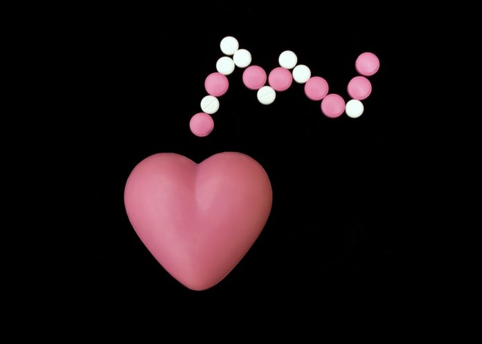 Heart symbol with pills