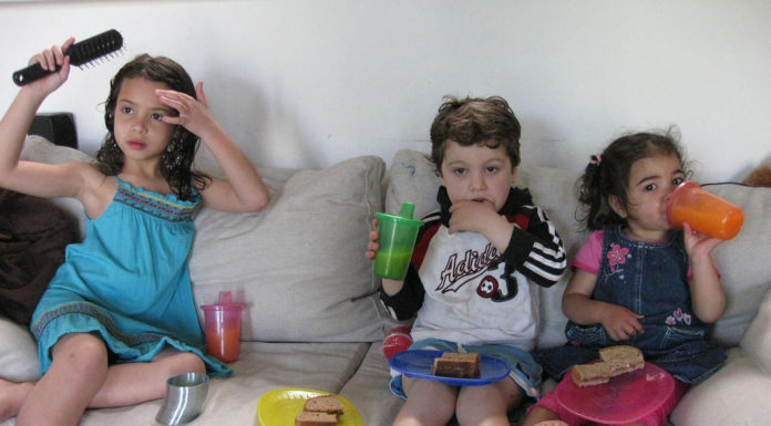 Kids watching TV and having junk food