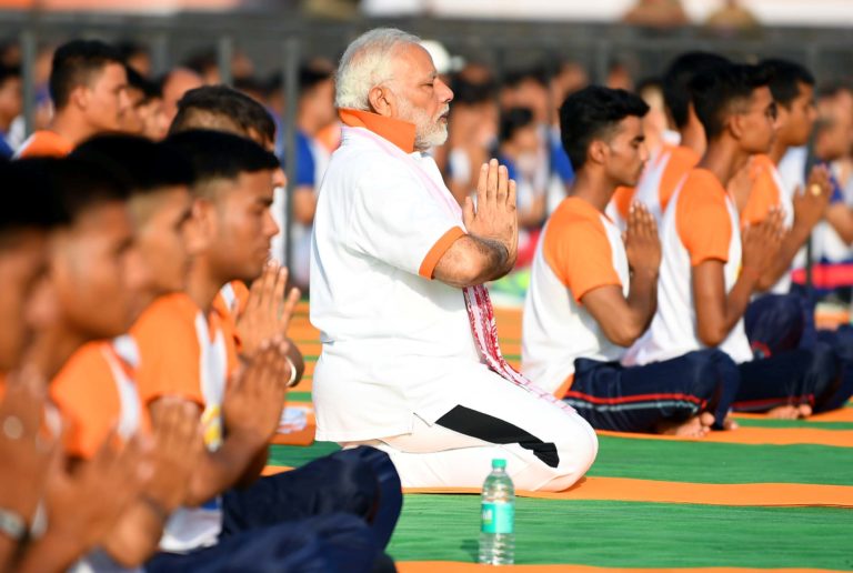 Yoga a passport to health insurance: Modi