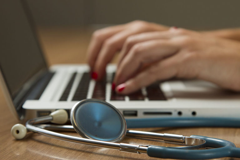 Stethoscope and Laptop Computer